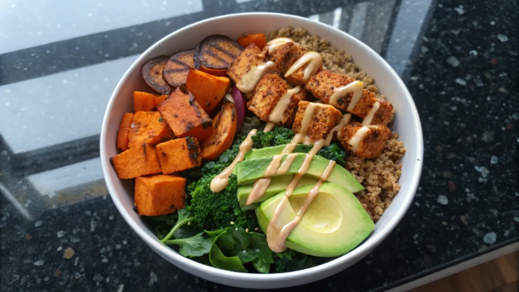 Quinoa salad with kale, roasted sweet potatoes, and tofu.